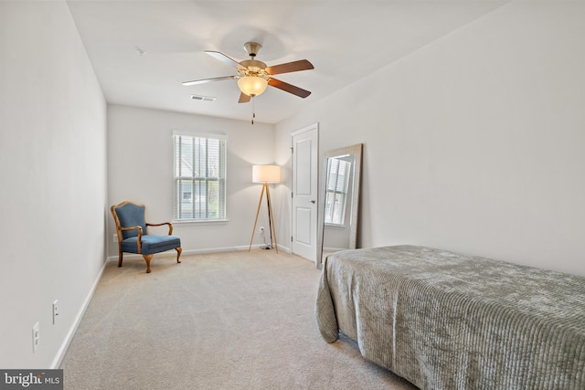 bedroom featuring a ceiling fan, baseboards, visible vents, and carpet