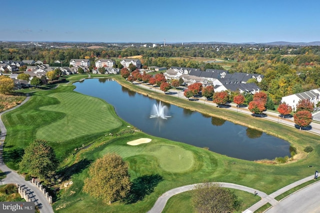 birds eye view of property featuring a water view, view of golf course, and a residential view