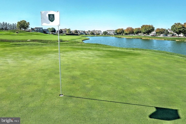 view of home's community featuring view of golf course and a water view