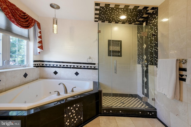 6420 Barrington Dr, Frederick, MD 21701 - bathroom featuring tile patterned flooring, tile walls, a jetted tub, and a stall shower