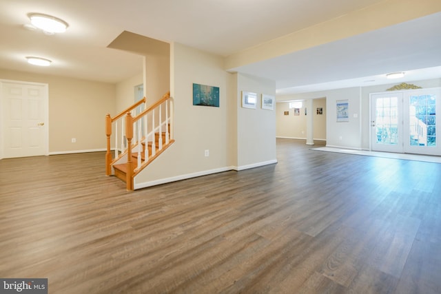 6420 Barrington Dr, Frederick, MD 21701 - spare room featuring dark wood-style flooring, baseboards, and stairway