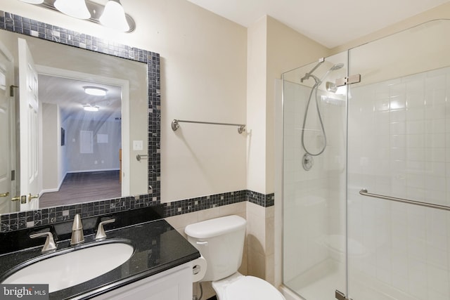 6420 Barrington Dr, Frederick, MD 21701 - bathroom featuring toilet, tile walls, a shower stall, and vanity