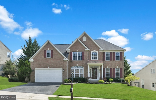 6420 Barrington Dr, Frederick, MD 21701 - view of front of home featuring a garage, a front yard, aphalt driveway, and brick siding