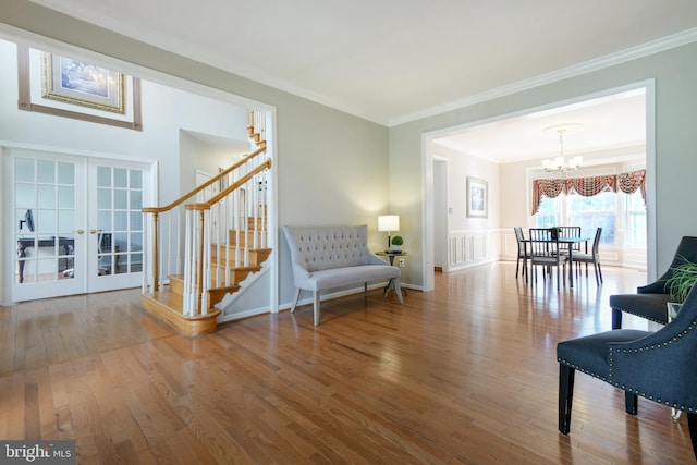 6420 Barrington Dr, Frederick, MD 21701 - sitting room featuring an inviting chandelier, french doors, crown molding, stairs, and wood finished floors