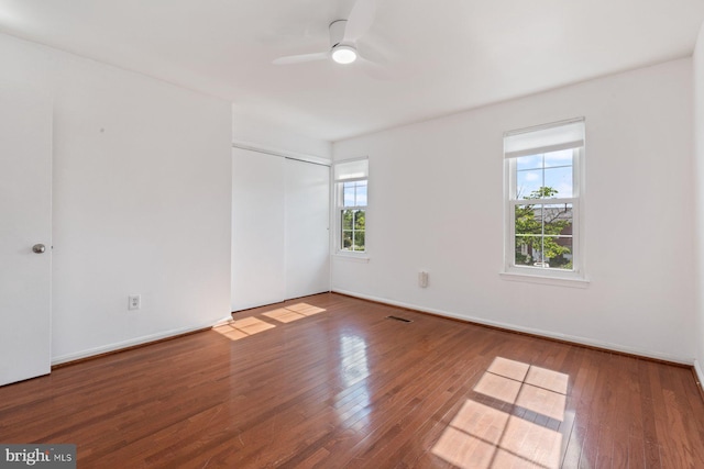 14311 Astrodome Dr Unit 6, Silver Spring, MD 20906 - unfurnished bedroom with wood finished floors, a closet, a ceiling fan, and baseboards