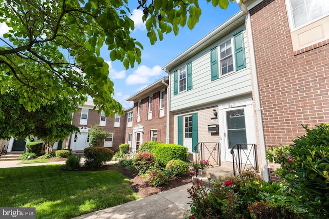 14311 Astrodome Dr Unit 6, Silver Spring, MD 20906 - multi unit property featuring brick siding and a front yard