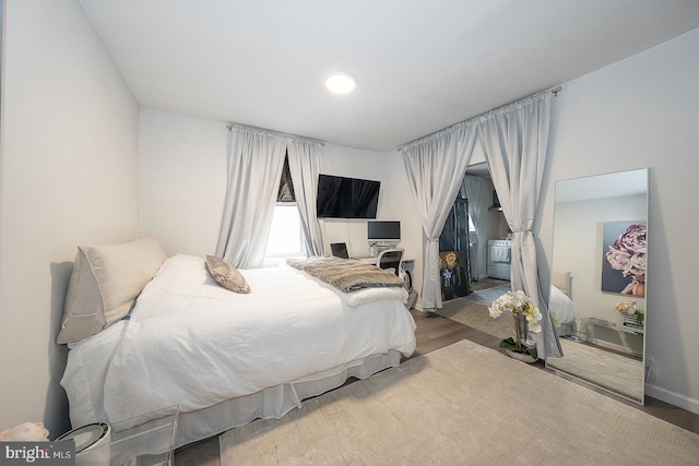 bedroom featuring wood finished floors