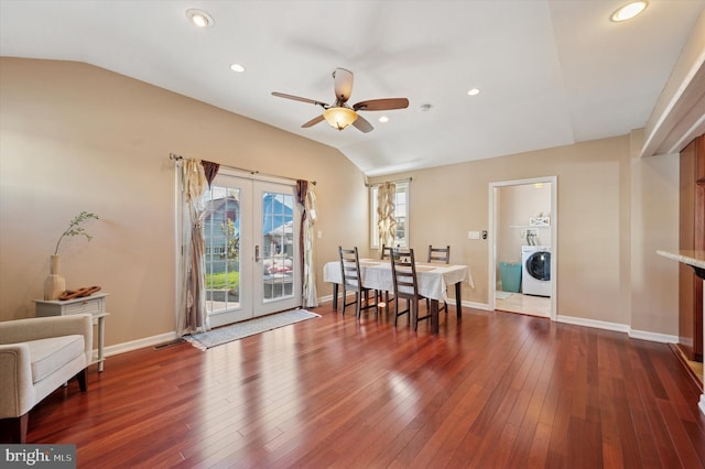 dining area featuring french doors, dark wood finished floors, vaulted ceiling, baseboards, and washer / clothes dryer