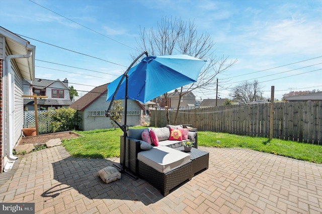 view of patio / terrace featuring a fenced backyard and an outdoor living space