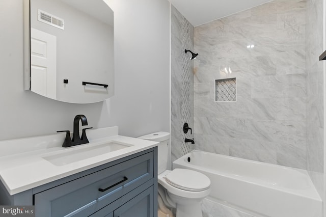 full bathroom featuring visible vents, toilet, shower / tub combination, and vanity