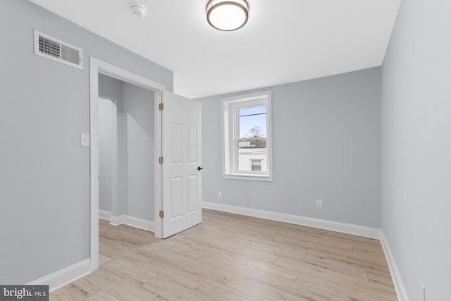 interior space with visible vents, baseboards, and light wood-style floors