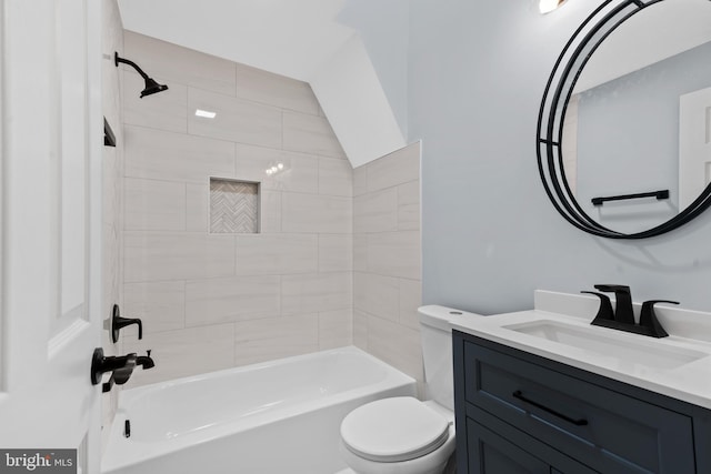 bathroom featuring toilet, vanity, and bathing tub / shower combination