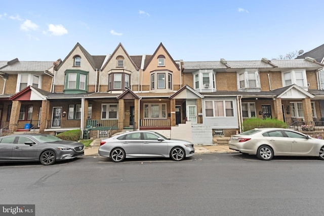 multi unit property with a residential view and brick siding