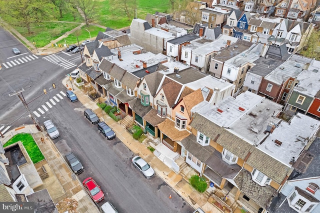 birds eye view of property with a residential view