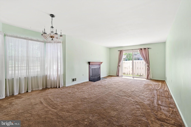 1 Huber Ct, Hightstown, NJ 08520 - unfurnished living room featuring a chandelier, carpet flooring, baseboards, and a fireplace with flush hearth
