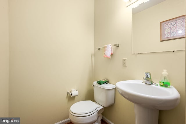 2410 Mallard Ln, Downingtown, PA 19335 - bathroom with baseboards, toilet, and a sink