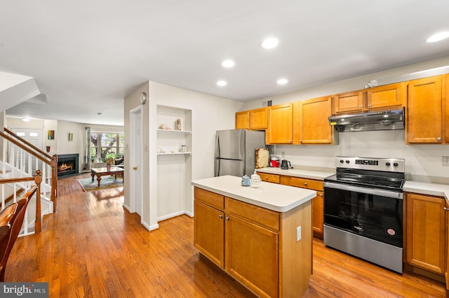 2410 Mallard Ln, Downingtown, PA 19335 - kitchen featuring light countertops, appliances with stainless steel finishes, a center island, and under cabinet range hood