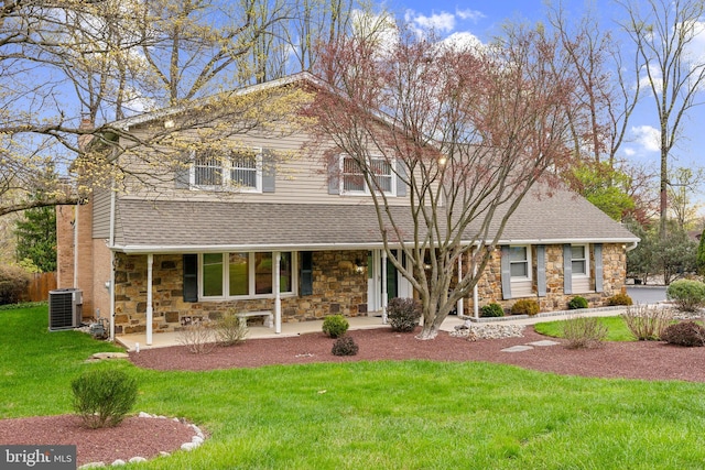 1419 Greenawalt Rd, Huntingdon Valley, PA 19006 - view of front of home featuring a front lawn, a shingled roof, stone siding, and central air condition unit