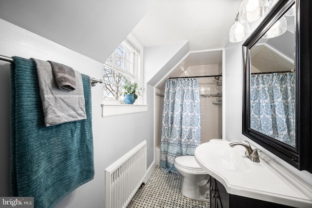 full bathroom featuring radiator heating unit, vanity, baseboards, and toilet