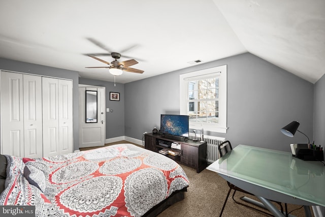bedroom featuring ceiling fan, baseboards, vaulted ceiling, visible vents, and a closet