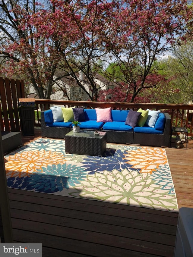 deck with an outdoor hangout area
