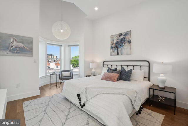1831 5th St NW, Washington, DC 20001 - bedroom featuring baseboards, recessed lighting, wood finished floors, and a towering ceiling