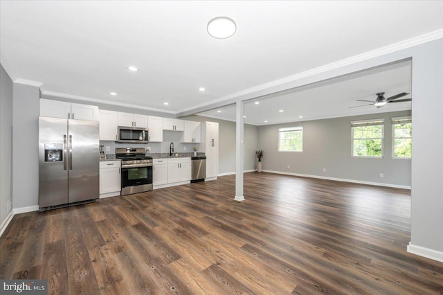 7533 Dover Ln, Lanham, MD 20706 - kitchen with appliances with stainless steel finishes, baseboards, crown molding, white cabinets, and recessed lighting