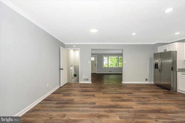 7533 Dover Ln, Lanham, MD 20706 - unfurnished living room with ornamental molding, dark wood-style floors, recessed lighting, and baseboards