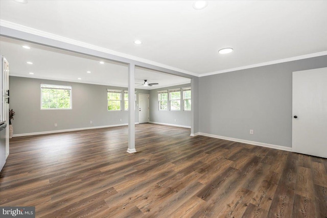 7533 Dover Ln, Lanham, MD 20706 - unfurnished living room featuring ornamental molding, plenty of natural light, ceiling fan, baseboards, and dark wood finished floors