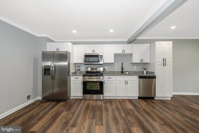 7533 Dover Ln, Lanham, MD 20706 - kitchen with appliances with stainless steel finishes, a sink, baseboards, dark wood-style floors, and ornamental molding