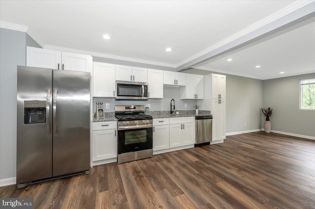 7533 Dover Ln, Lanham, MD 20706 - kitchen with appliances with stainless steel finishes, white cabinetry, dark wood finished floors, crown molding, and light stone counters
