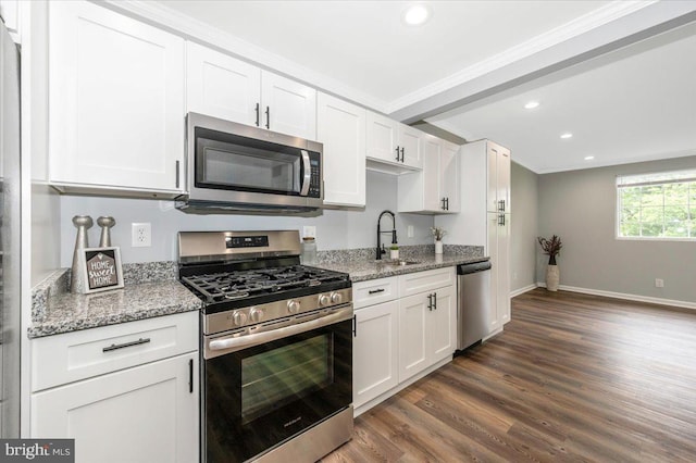 7533 Dover Ln, Lanham, MD 20706 - kitchen featuring stainless steel appliances, a sink, ornamental molding, recessed lighting, and white cabinetry