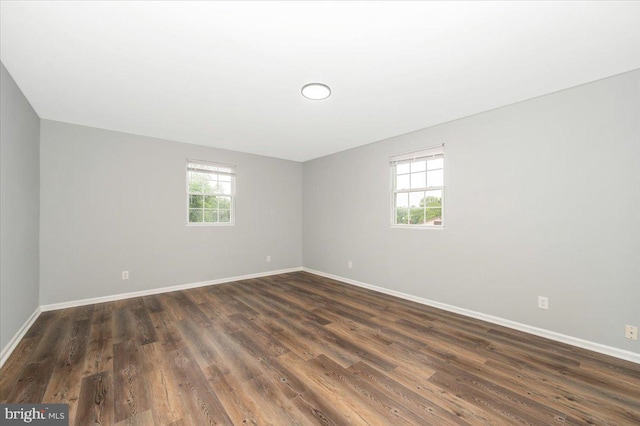 7533 Dover Ln, Lanham, MD 20706 - unfurnished room with baseboards and dark wood-type flooring