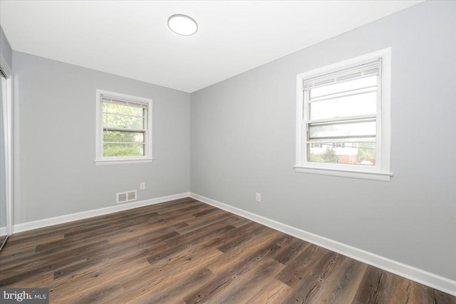 7533 Dover Ln, Lanham, MD 20706 - spare room featuring baseboards and dark wood-style floors