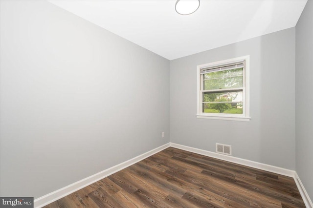 7533 Dover Ln, Lanham, MD 20706 - spare room featuring baseboards and dark wood-type flooring
