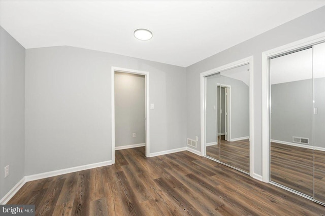 7533 Dover Ln, Lanham, MD 20706 - empty room featuring dark wood-type flooring, baseboards, and lofted ceiling