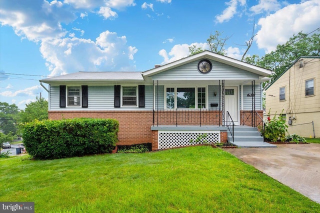 7533 Dover Ln, Lanham, MD 20706 - single story home featuring brick siding, a front yard, and a porch