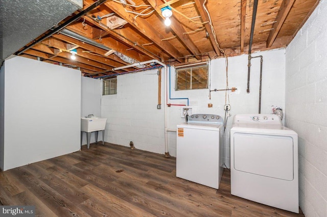 7533 Dover Ln, Lanham, MD 20706 - washroom with independent washer and dryer, concrete block wall, and wood finished floors