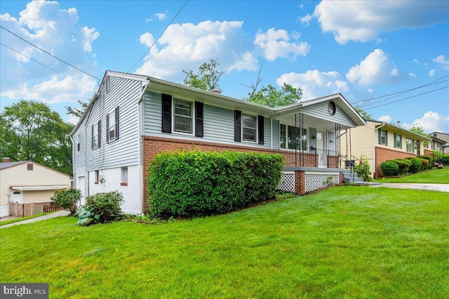 7533 Dover Ln, Lanham, MD 20706 - ranch-style house featuring brick siding, a porch, and a front yard