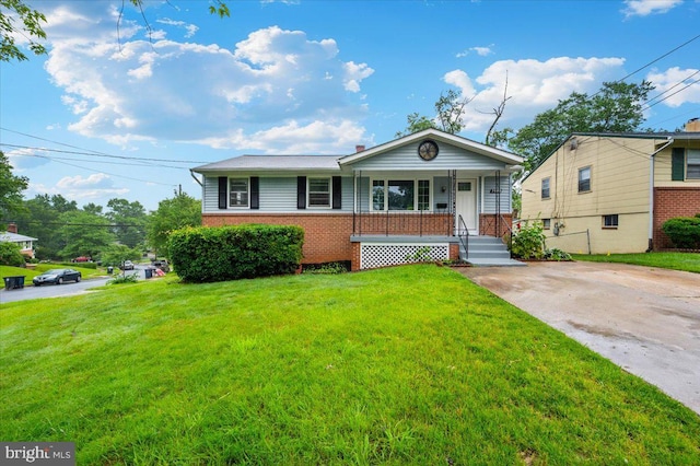 7533 Dover Ln, Lanham, MD 20706 - view of front facade with a porch, brick siding, and a front yard