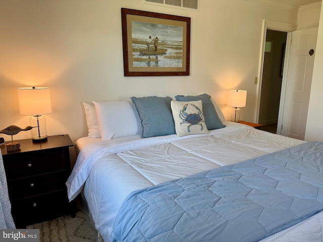 bedroom featuring visible vents