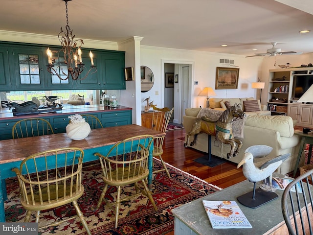 dining area with recessed lighting, dark wood-style floors, crown molding, visible vents, and ceiling fan with notable chandelier