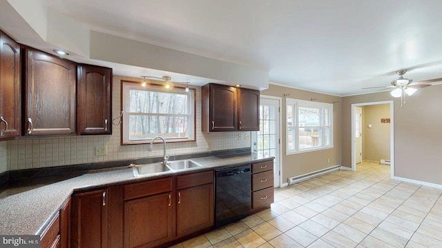 kitchen featuring light tile patterned floors, a sink, a baseboard heating unit, black dishwasher, and backsplash