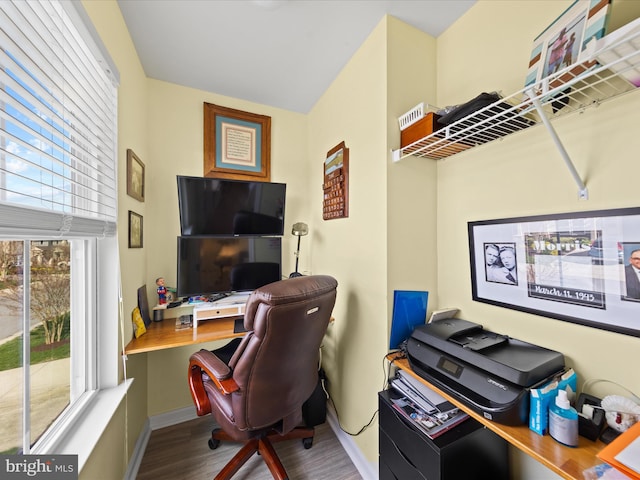 home office with wood finished floors, baseboards, and plenty of natural light
