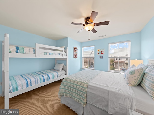 bedroom featuring visible vents and a ceiling fan