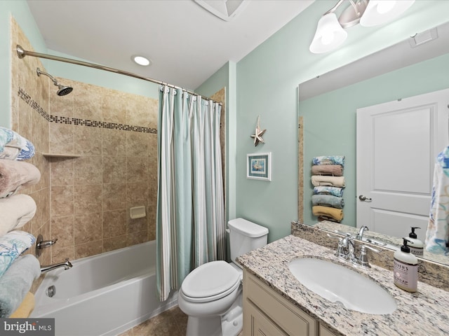 full bathroom featuring tile patterned flooring, shower / bath combination with curtain, toilet, and vanity