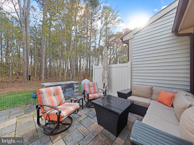 view of patio with outdoor lounge area and fence