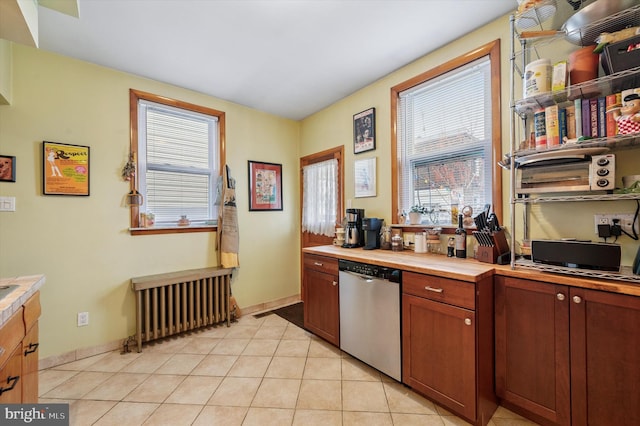 3257 Almond St, Philadelphia, PA 19134 - kitchen featuring dishwasher, radiator, a healthy amount of sunlight, and light tile patterned floors