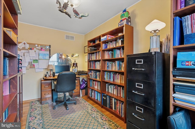 3257 Almond St, Philadelphia, PA 19134 - office with wall of books, wood finished floors, and visible vents