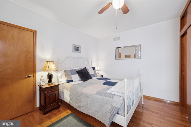 3257 Almond St, Philadelphia, PA 19134 - bedroom with baseboards, a ceiling fan, wood finished floors, and visible vents